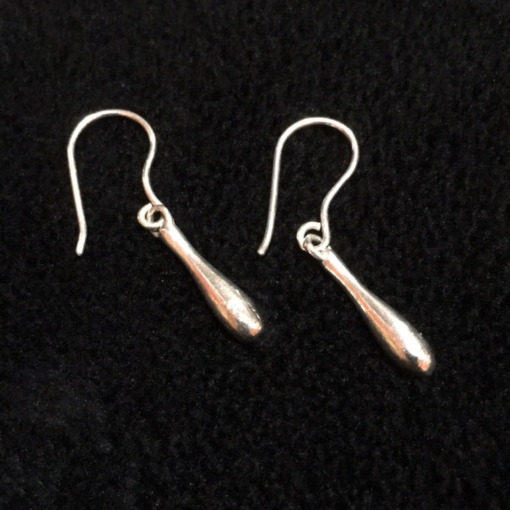 Dangling tear drop earrings.
